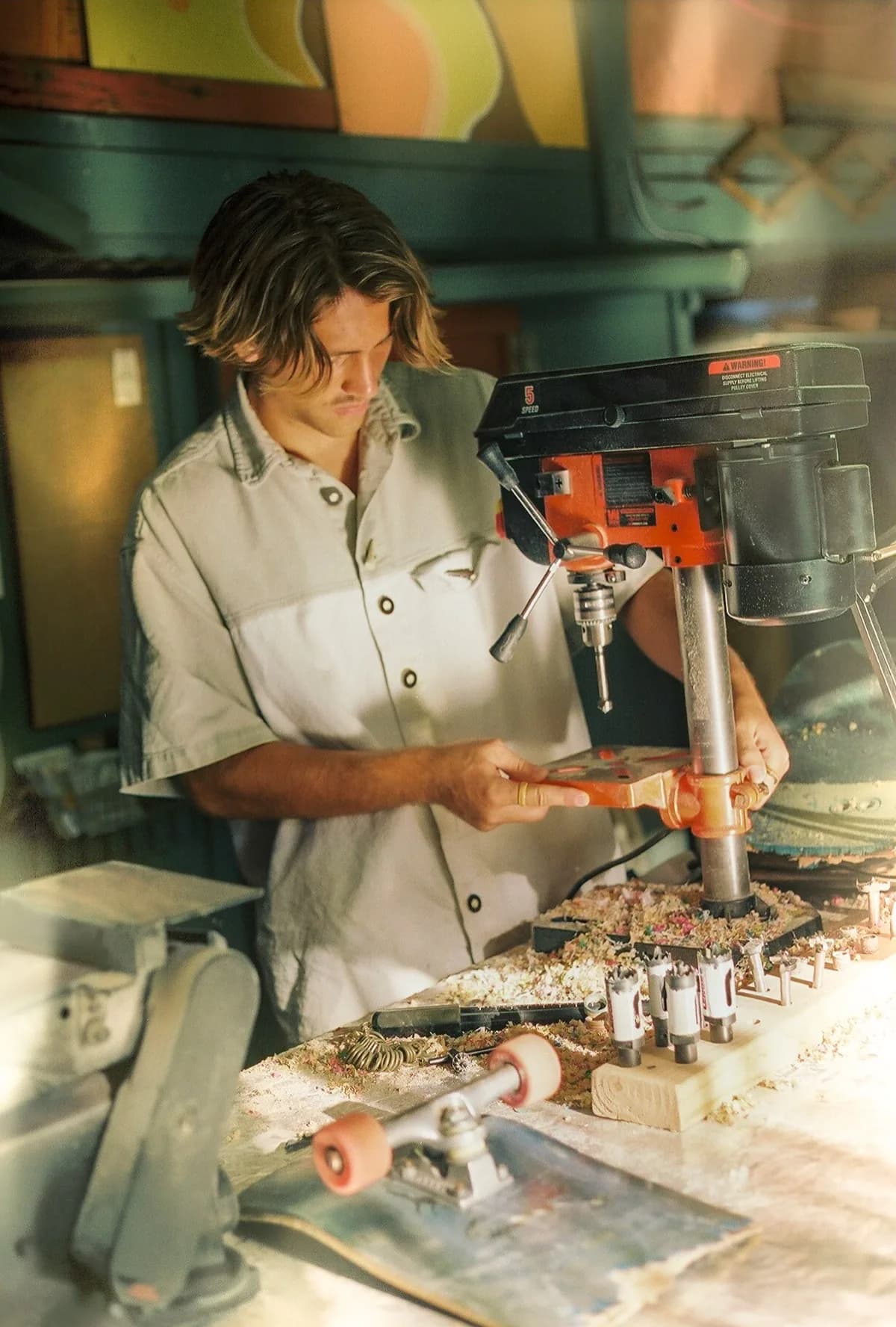 Daniel Malzl at the drill press making rings in his workshop