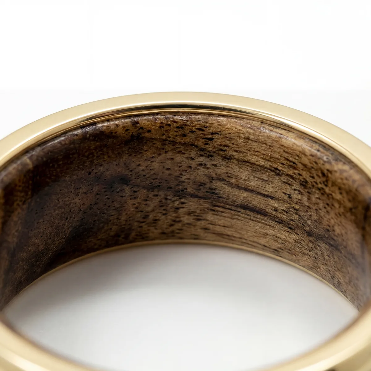Ring close-up showing material quality and wood grain detail